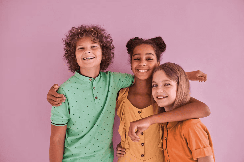 three kids smiling